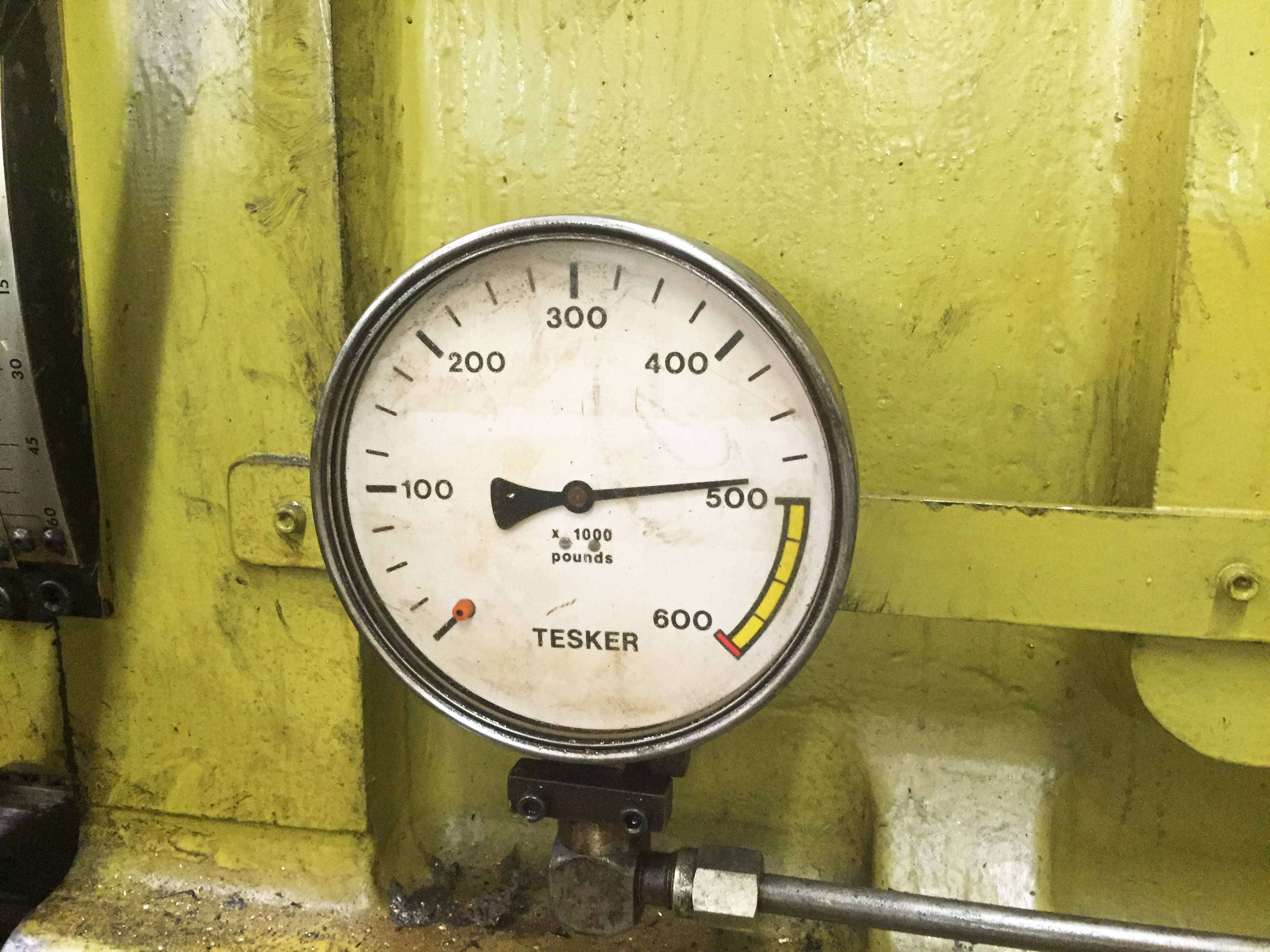 HAldf a million pounds of pressure are imparted on the rolls to plastically move the steel of the bar into the thread form. Read the gage.